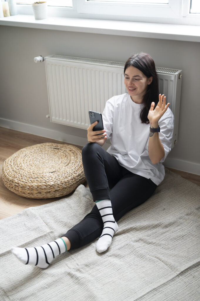 woman-talking-her-smartphone-home-quarantine